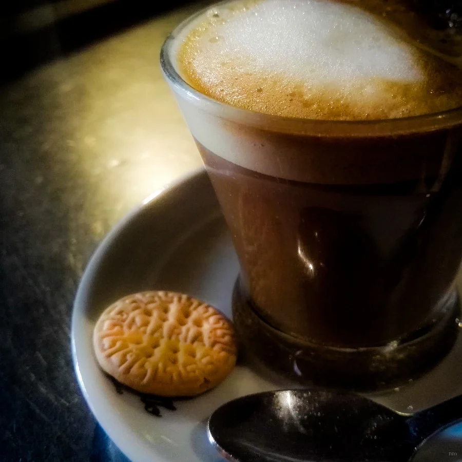 Cortado coffee in a glass.